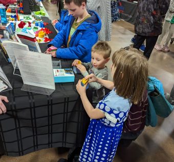 Visitors enjoying learning math through 3D printing