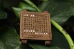 This Tiny Wooden Word Clock Can Be Worn as a Watch